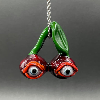 Cherry flavored glass eye pendant