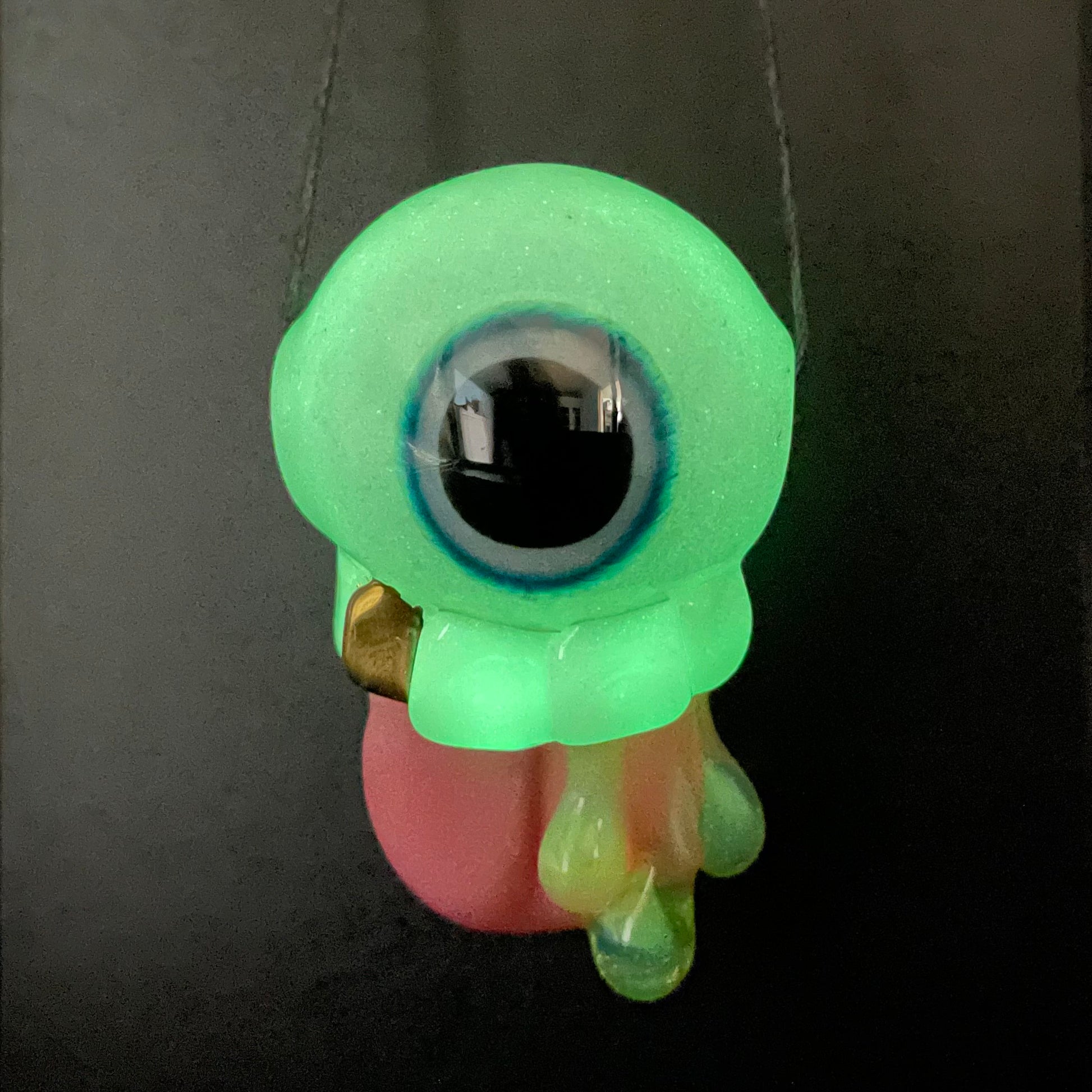 Artisan glass Glow in the dark eye pendant - detailed craftsmanship