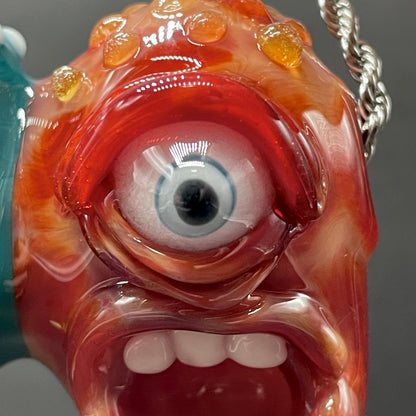 Two Headaches Are Better Than One handblown glass pendant - teal cyclops head with white teeth and green slime fused with red cyclops head with pink tongue, silver rope chain - Leviathan Glass