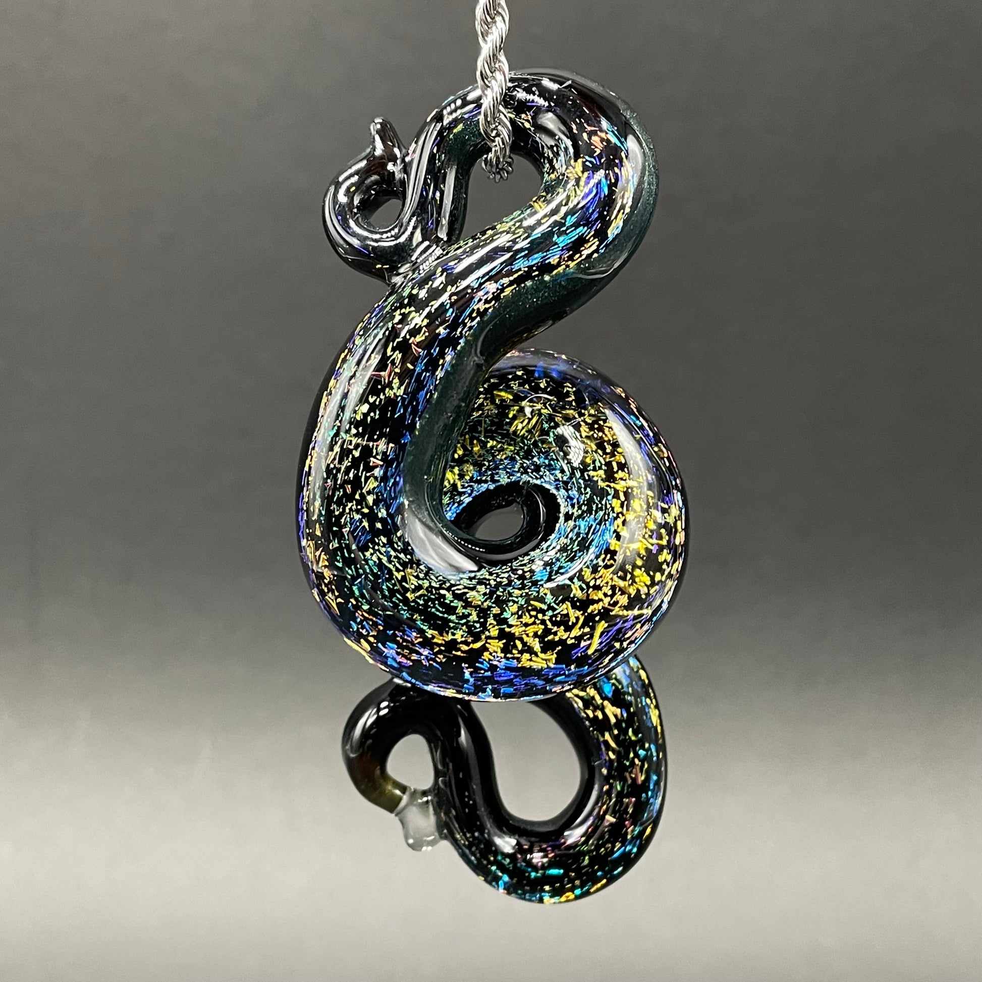 Dichroic rainbow sparkle snake pendant detail view - premium glass art