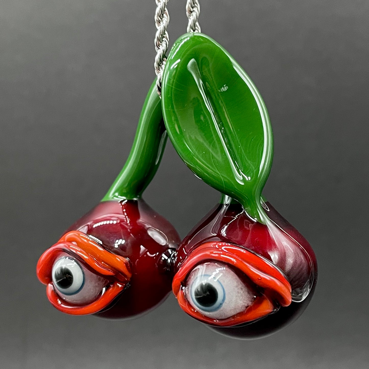 Cherry flavored glass eye pendant