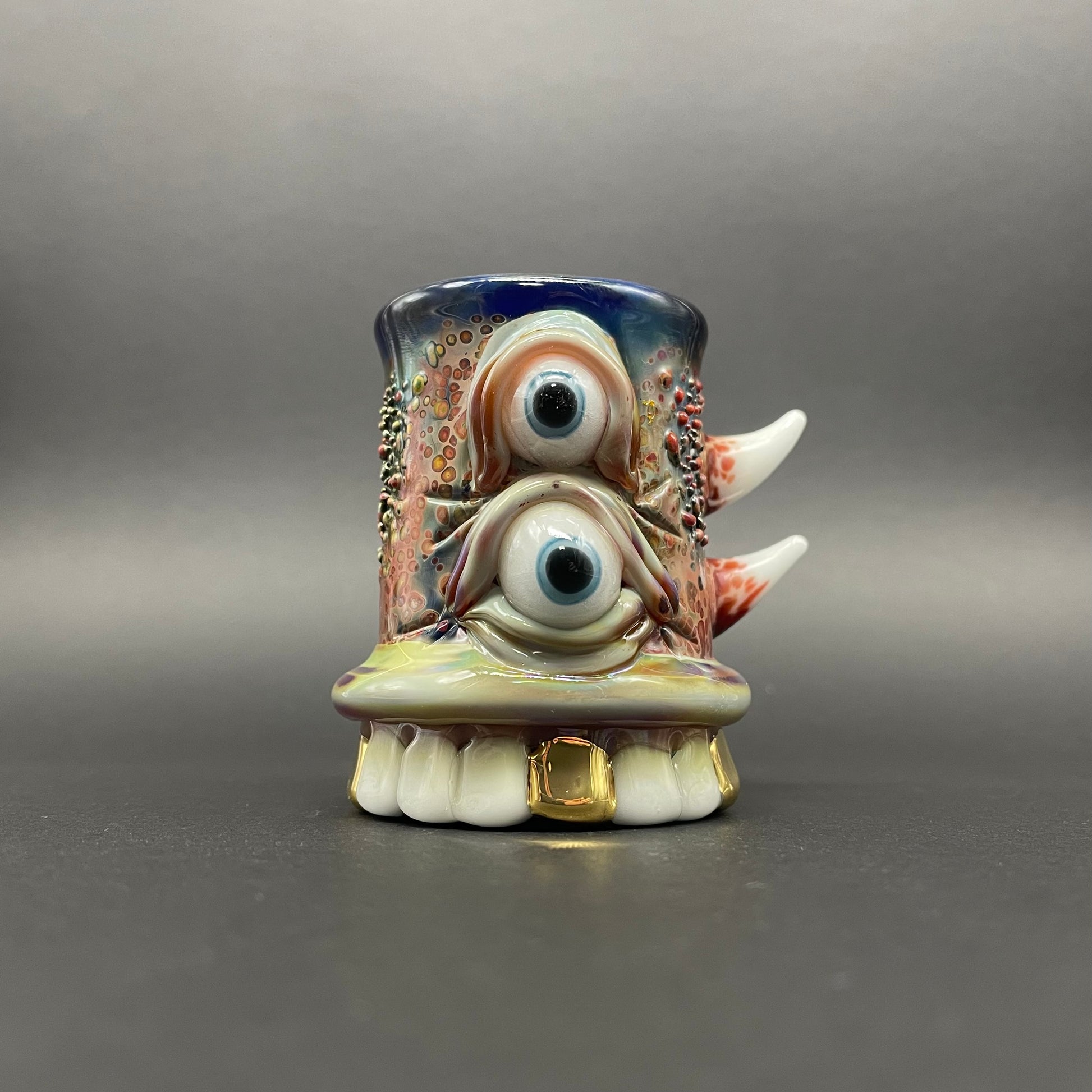 Hand-blown glass chompers shot glass with a mouth full of teeth by Leviathan Glass