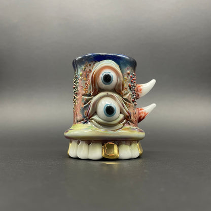 Hand-blown glass chompers shot glass with a mouth full of teeth by Leviathan Glass