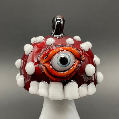 Close-up of Cyclops mushroom ornament - handcrafted glass