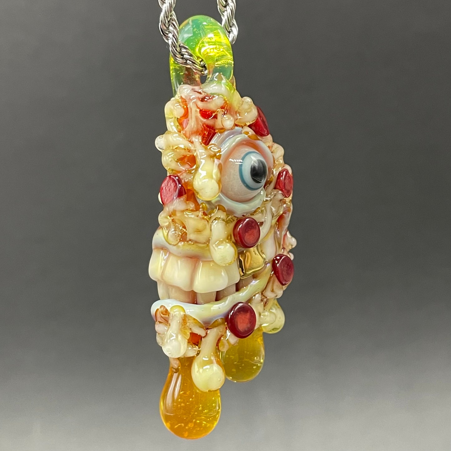 Two halves of one pizza friendship necklace by Leviathan Glass - artisan detail