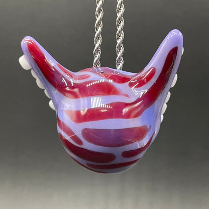 Grinning Cheshire cat glass pendant