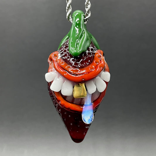Toothy strawberry pendant detail view - premium glass art