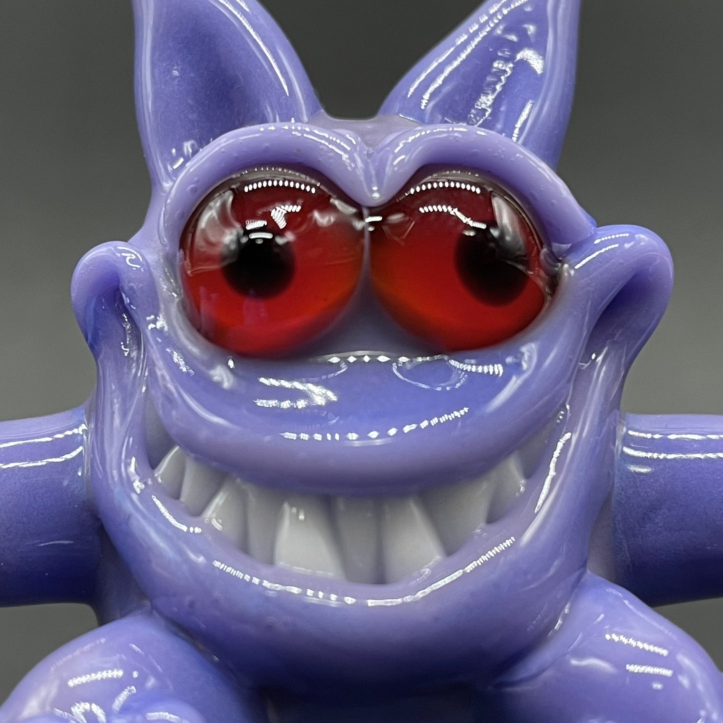 Gengar Pokémon handblown glass pendant - periwinkle purple Gengar sculpture, large red glass eyes, white teeth, clawed hands and feet, silver rope chain - Leviathan Glass