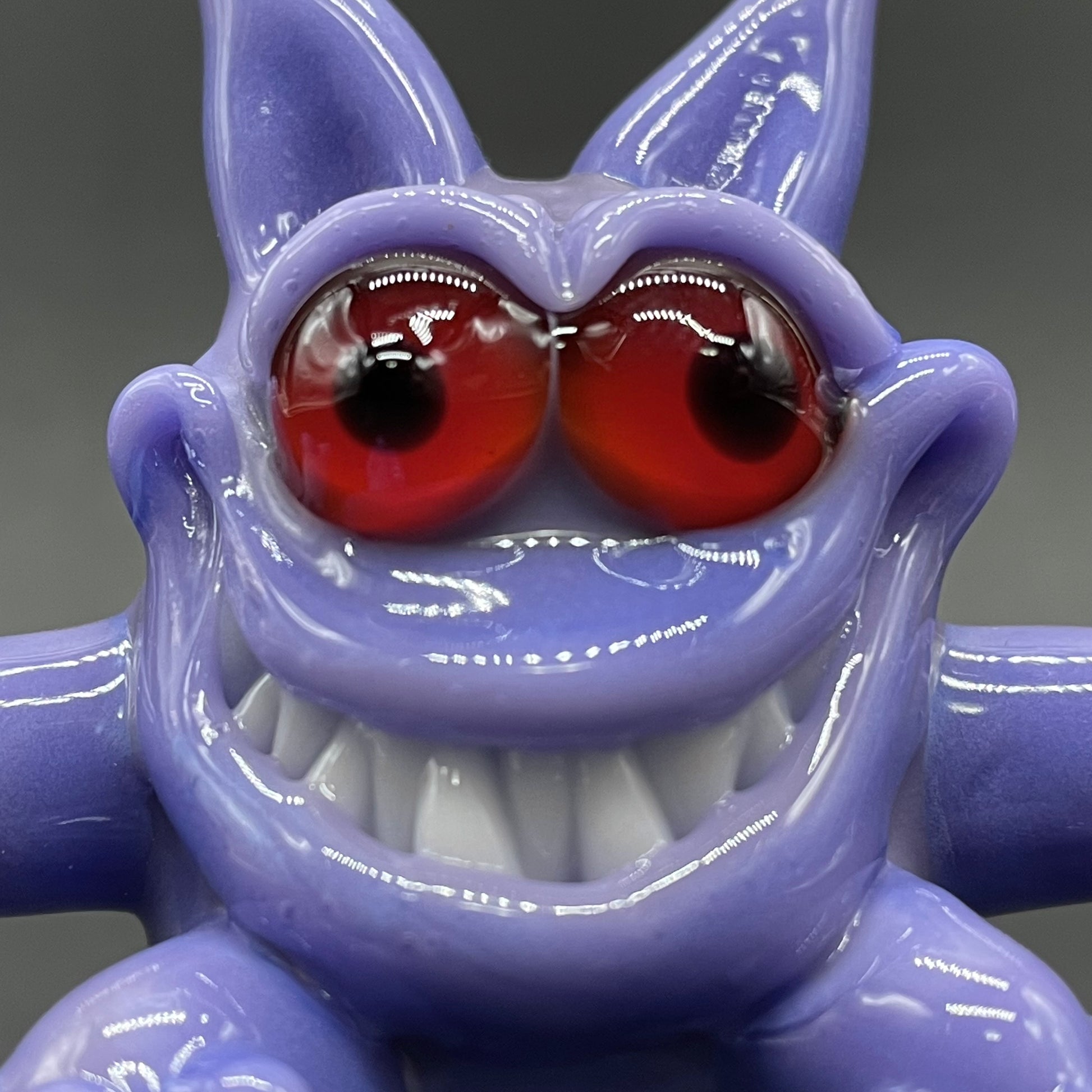 Gengar Pokémon handblown glass pendant - periwinkle purple Gengar sculpture, large red glass eyes, white teeth, clawed hands and feet, silver rope chain - Leviathan Glass