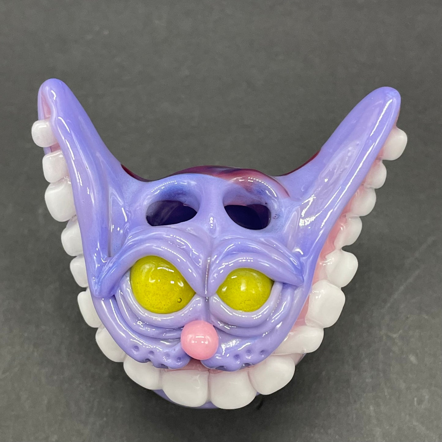 Grinning Cheshire cat glass pendant