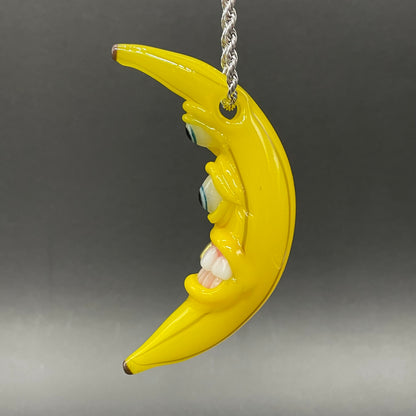 Grinning glass banana pendant