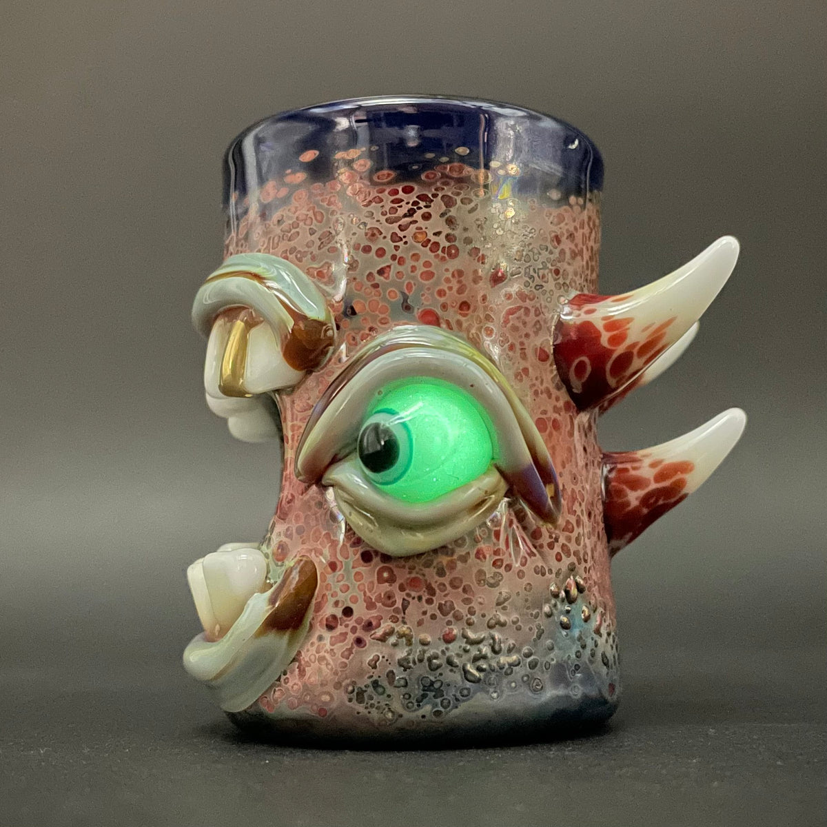 Close-up of Screaming shot glass - handcrafted glass