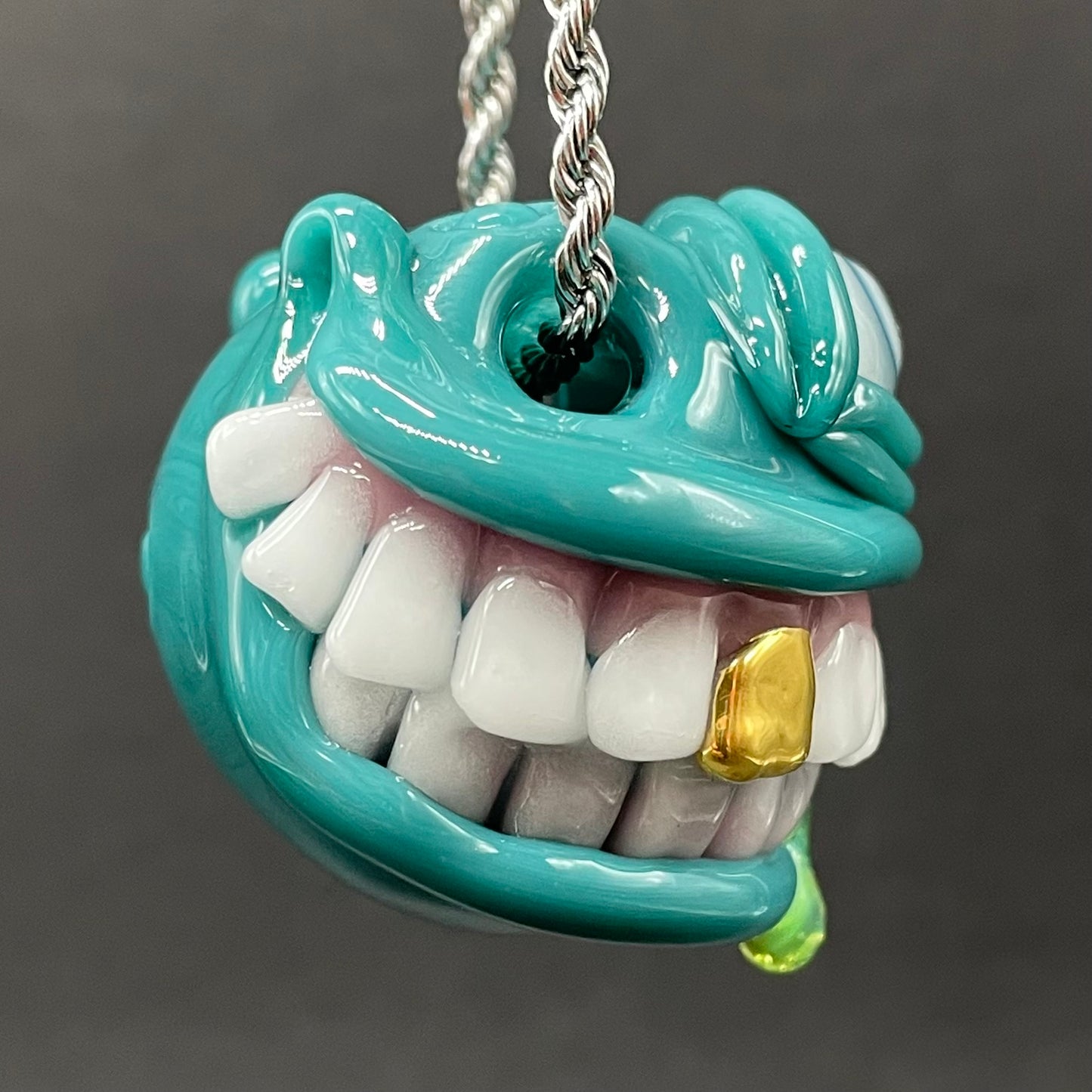 Grinning Like a Fool handblown glass pendant - oversized grinning monster face, white teeth, gold tooth, opal accents, silver rope chain - Leviathan Glass