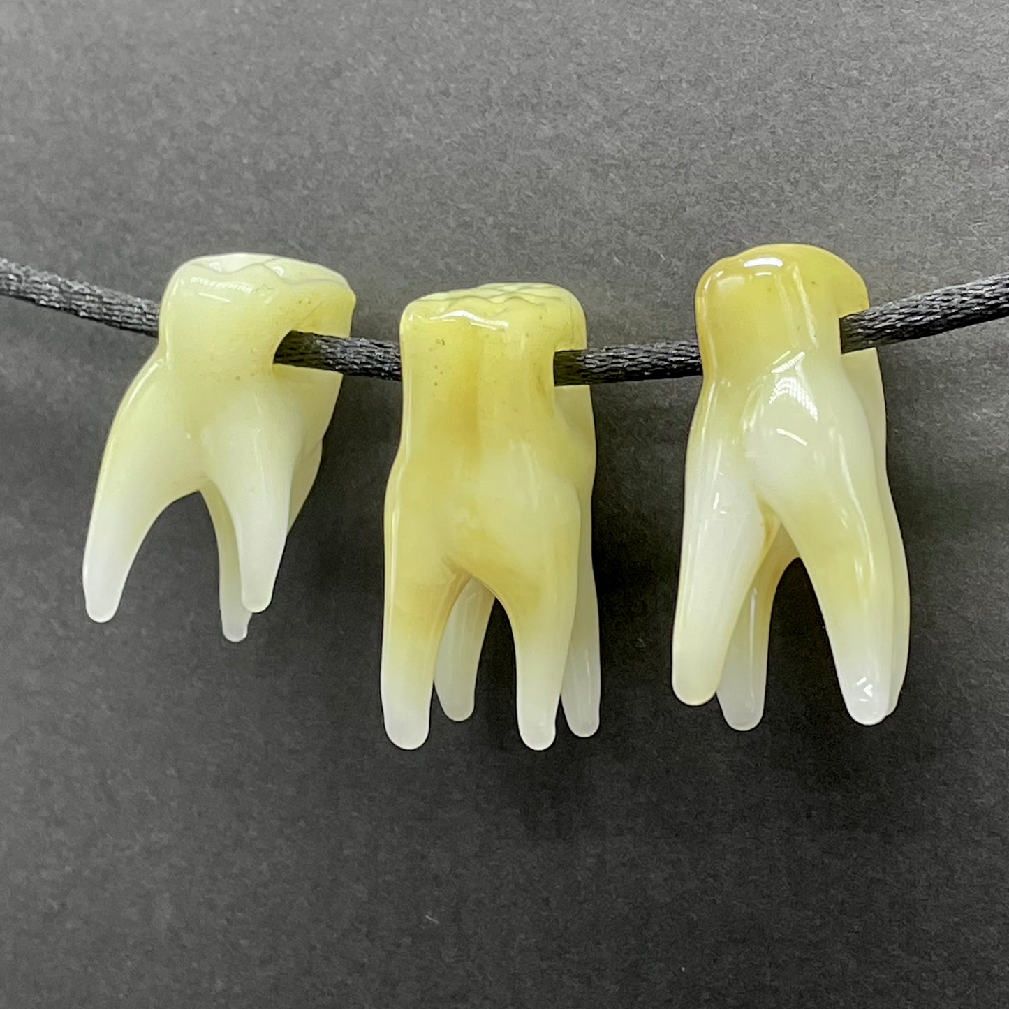 3 glass tooth beads craftsmanship - artisan glass work