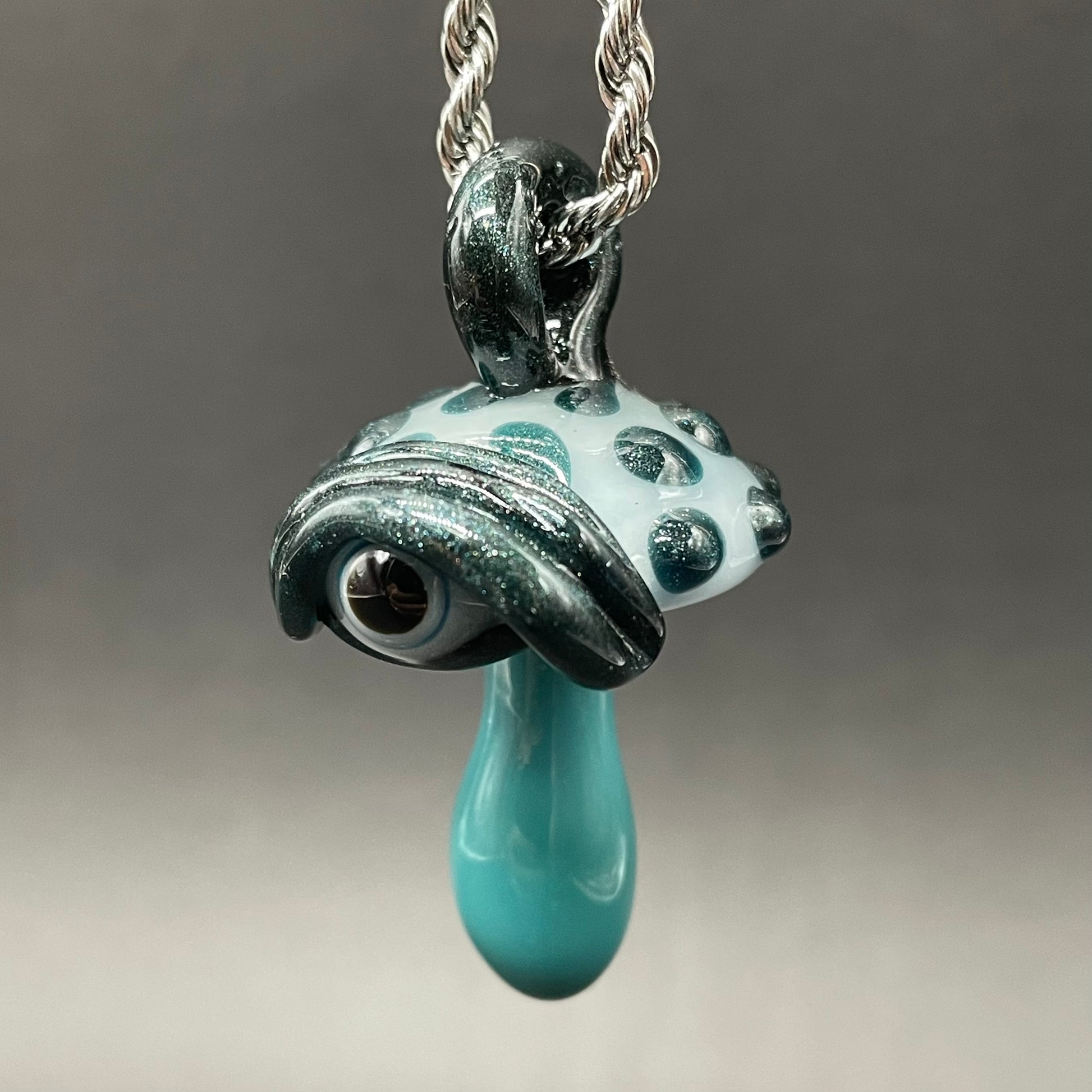 Close-up of Cyclops mushroom pendant - handcrafted glass