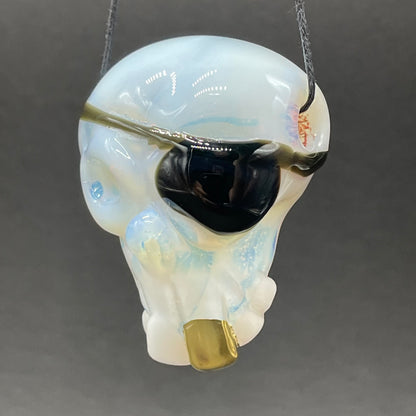 Hand-blown glass one eyed Willie skull pendant by Leviathan Glass