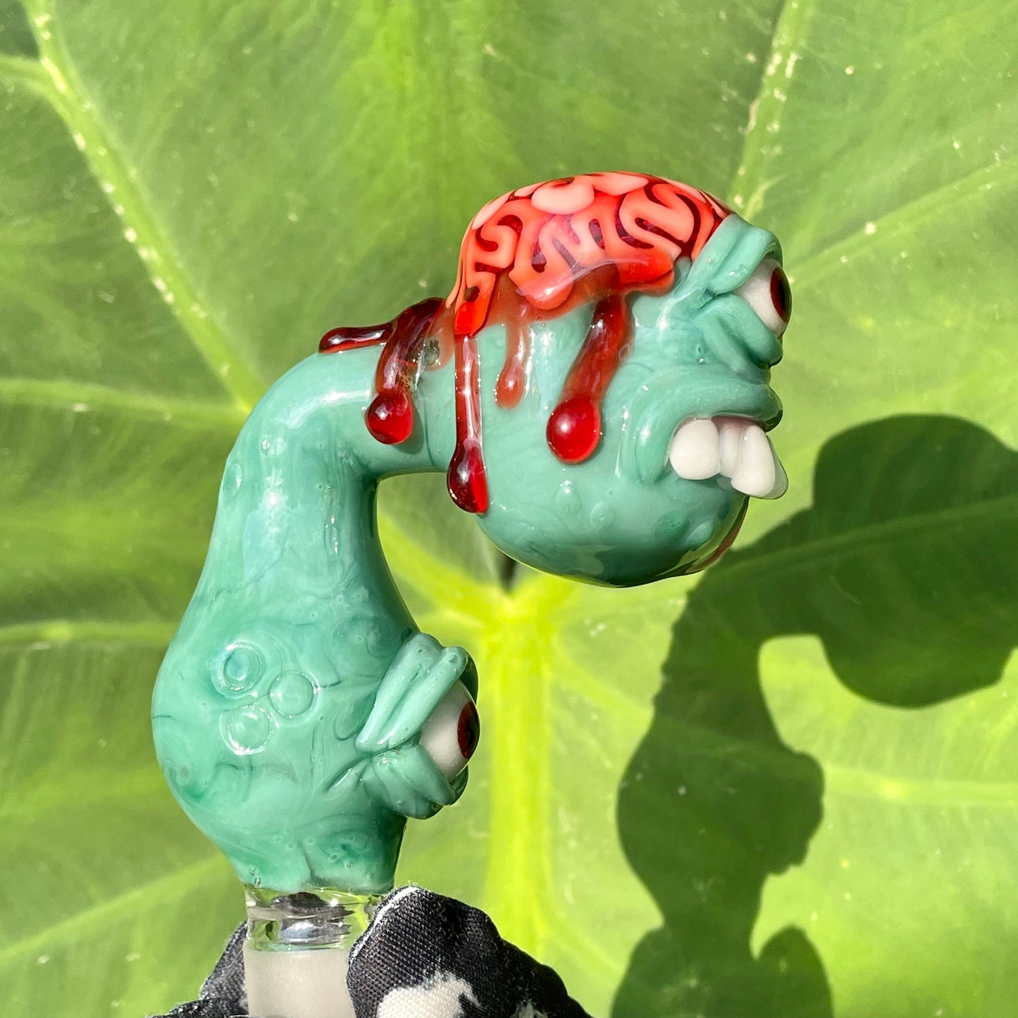 Close-up of 18mm single hole Brainless bob slide - handcrafted glass