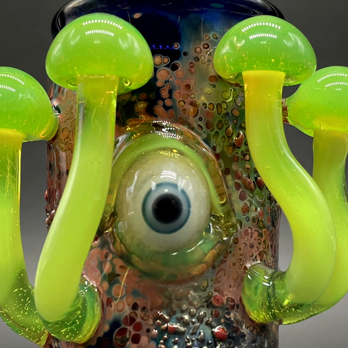 Close-up of Green slime mushroom shot glass - handcrafted glass