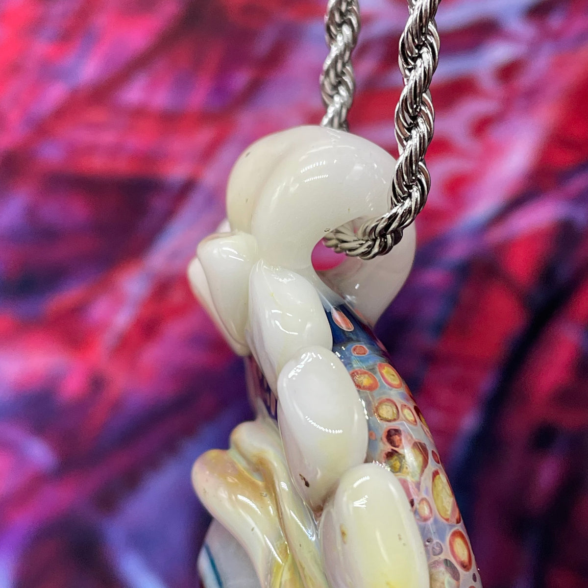 Unidentified Object Delta handblown glass pendant - circular disc ringed with ivory teeth, blue iris eye center, eyelid, gold tooth accent, silver rope chain - Leviathan Glass