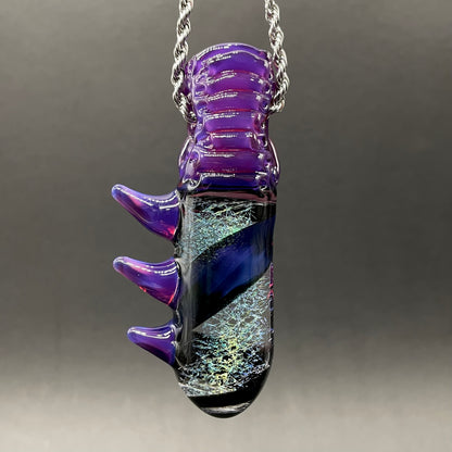 Close-up of Royal jelly dichroic cyclops pendant - handcrafted glass
