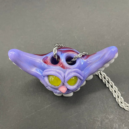 Grinning Cheshire cat glass pendant
