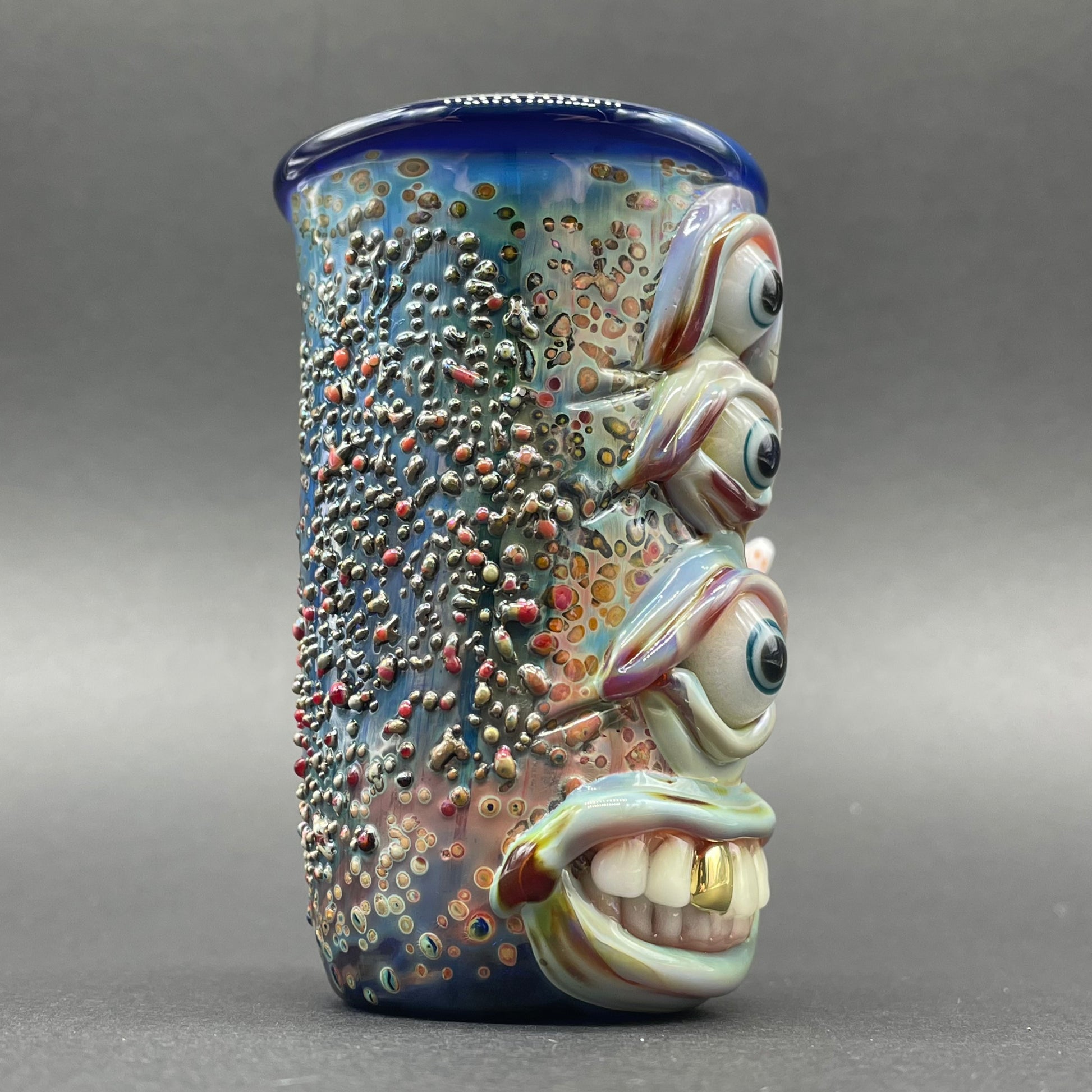 Vertical 3 eye shot glass craftsmanship - artisan glass work