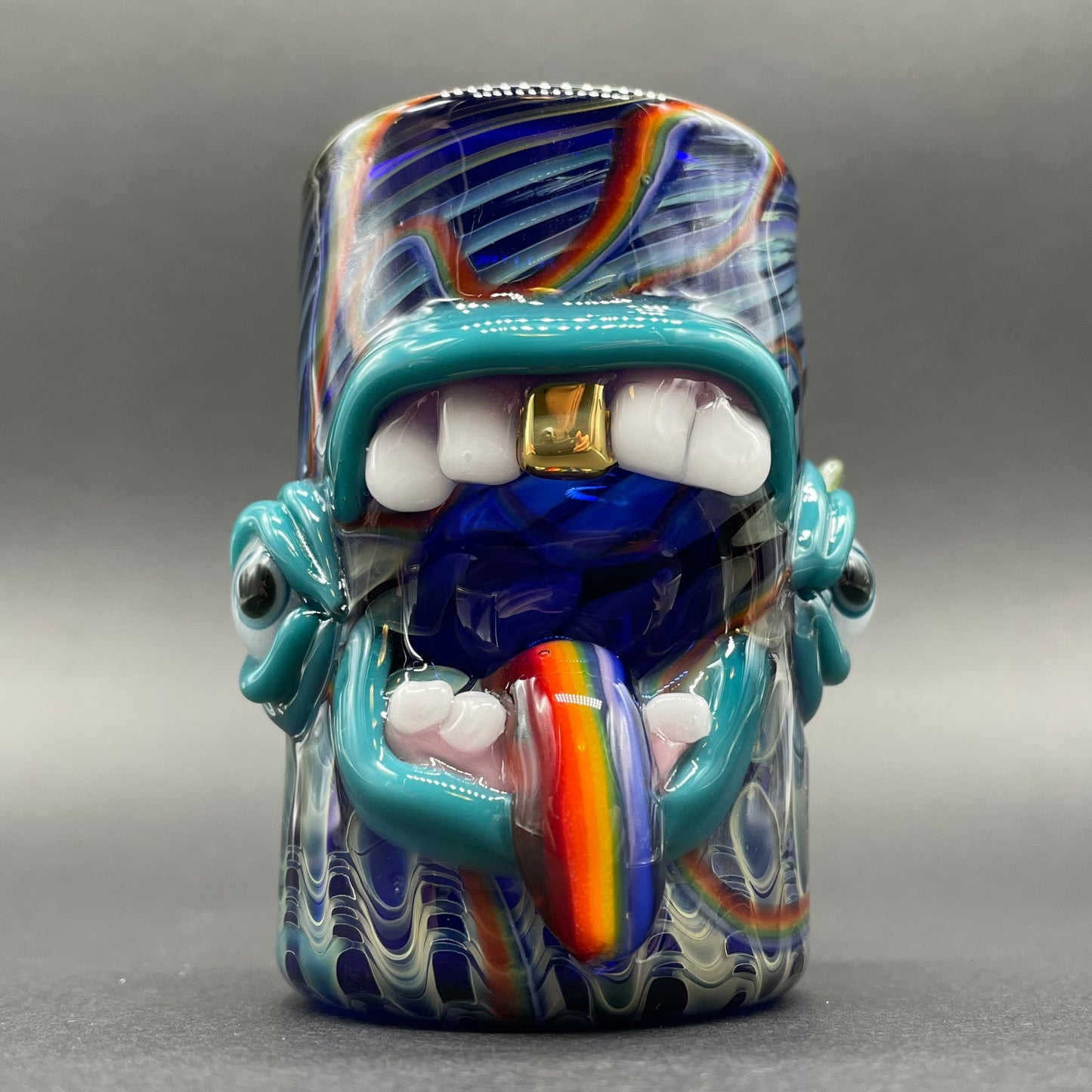 Close-up of Screaming rainbow tongue shot glass - handcrafted glass