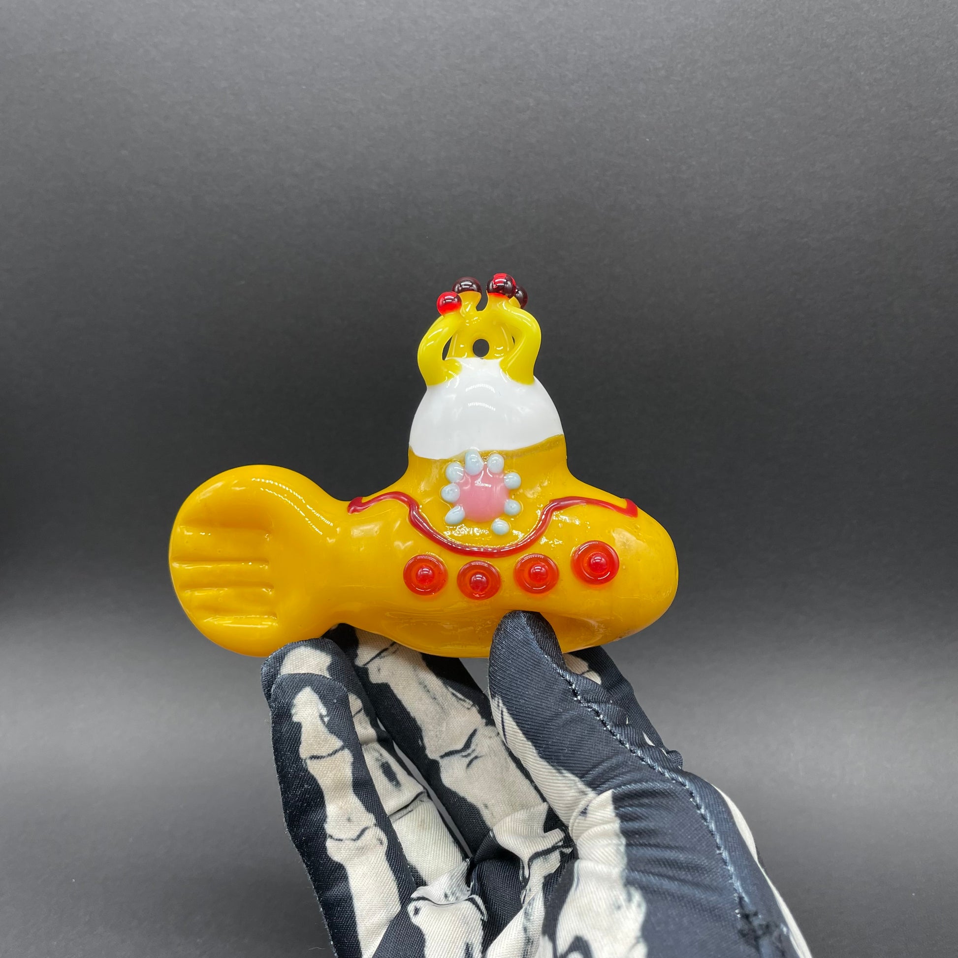Close-up of glass yellow submarine ornament - handcrafted glass