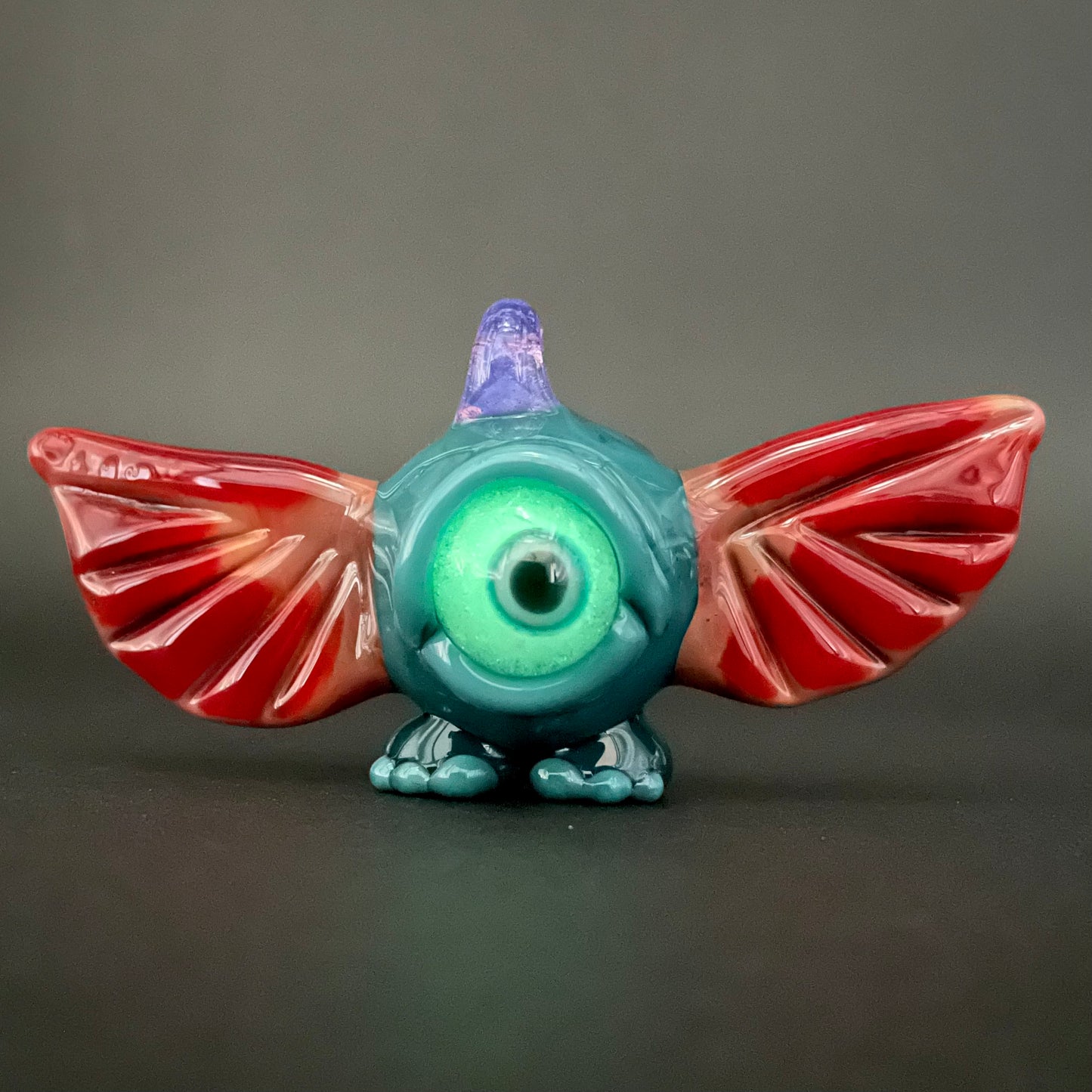 flying cyclops pendant detail view - premium glass art