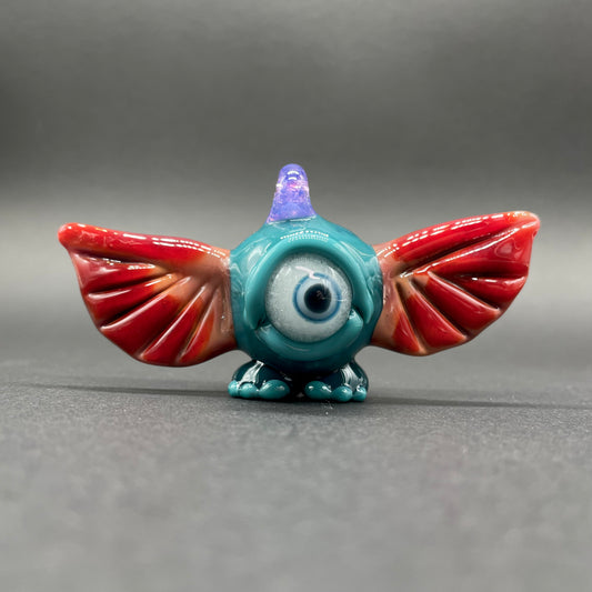 Hand-blown glass flying cyclops pendant by Leviathan Glass