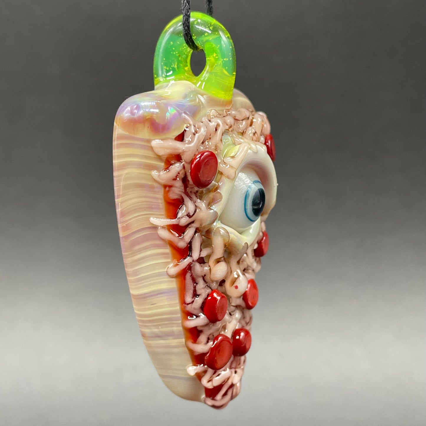 Close-up of glass Pizza pendant - handcrafted glass