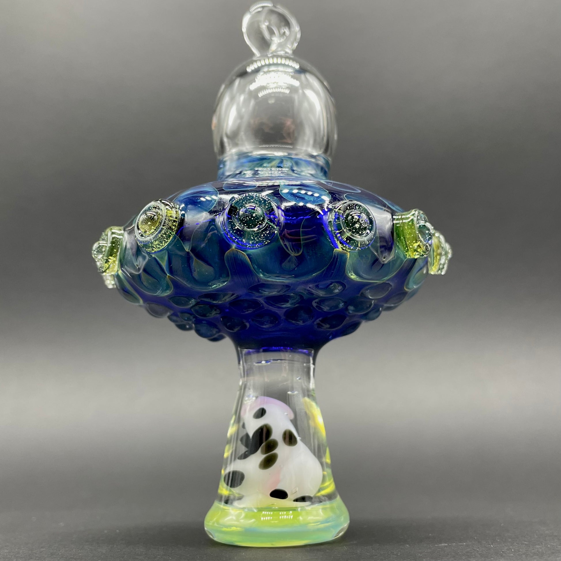 Close-up of Alien Abduction Ornament (Cow) - handcrafted glass