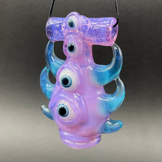 Pink slime evil eye pendant detail view - premium glass art