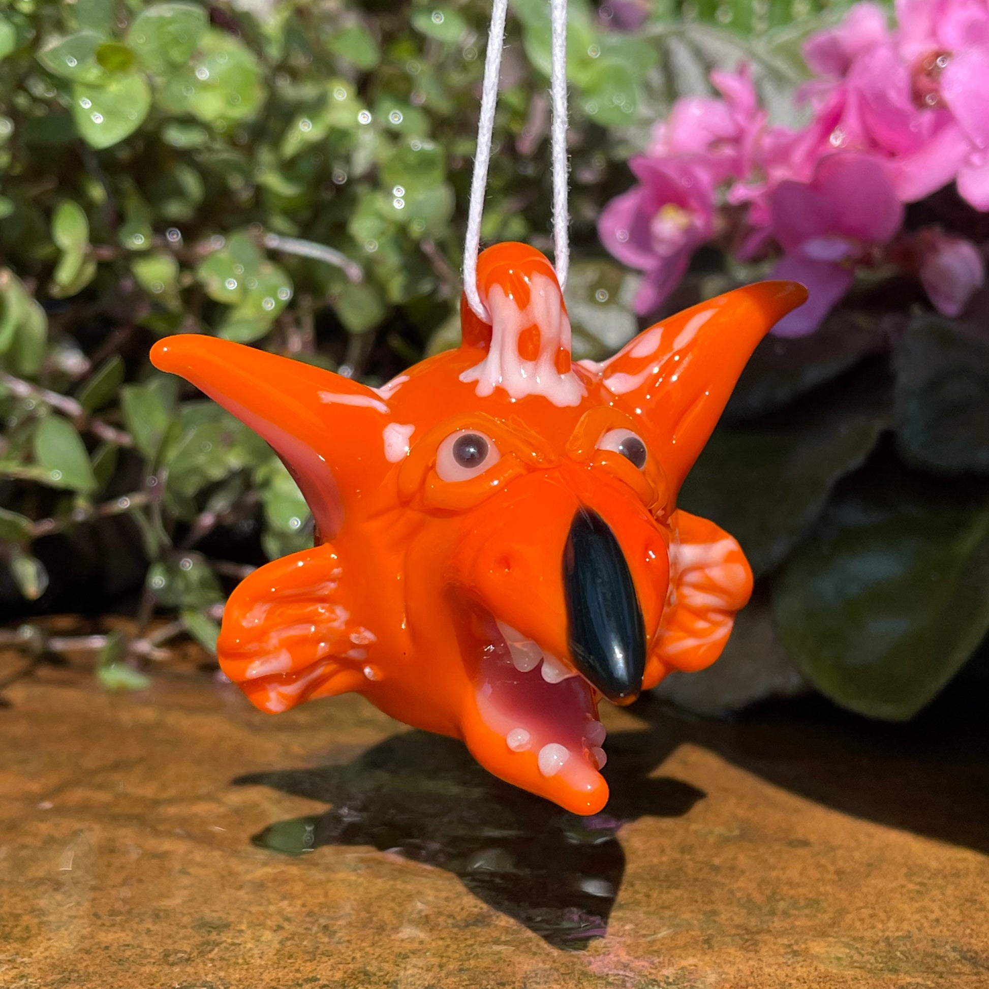 Close-up of Glass Fireys pendant - handcrafted glass