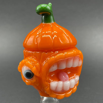 Close-up of 14mm pumpkin slide with cap - handcrafted glass