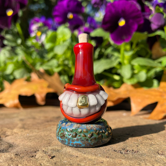 Hand-blown glass Red grinning glass cork bottle by Leviathan Glass