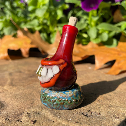 Red grinning glass cork bottle craftsmanship - artisan glass work