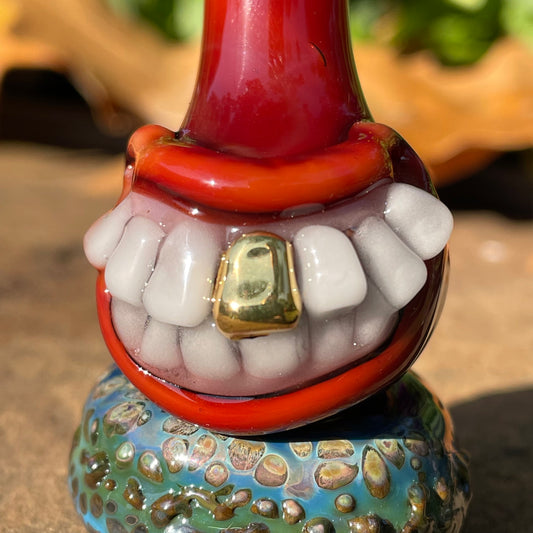 Red grinning glass cork bottle detail view - premium glass art