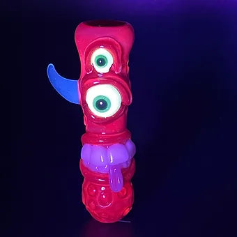 Close-up of Red UV Reactive Chillum - handcrafted glass