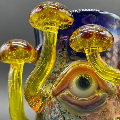 Close-up of Yellow mushroom shot glass - handcrafted glass
