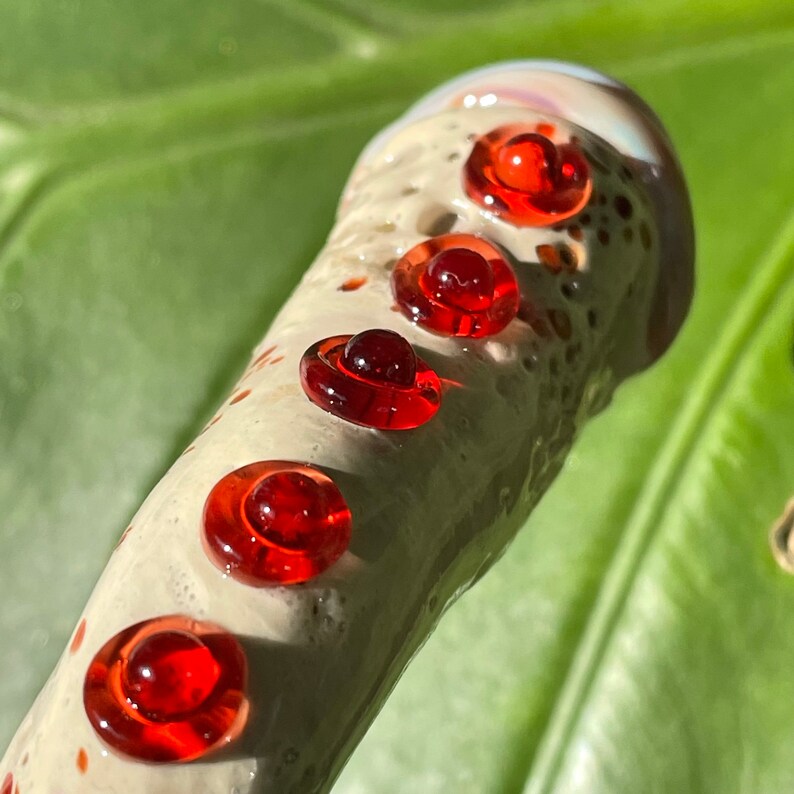 Leviathan Glass Glass makeup brush with glow in the dark eye and red suckers. - hand-blown art