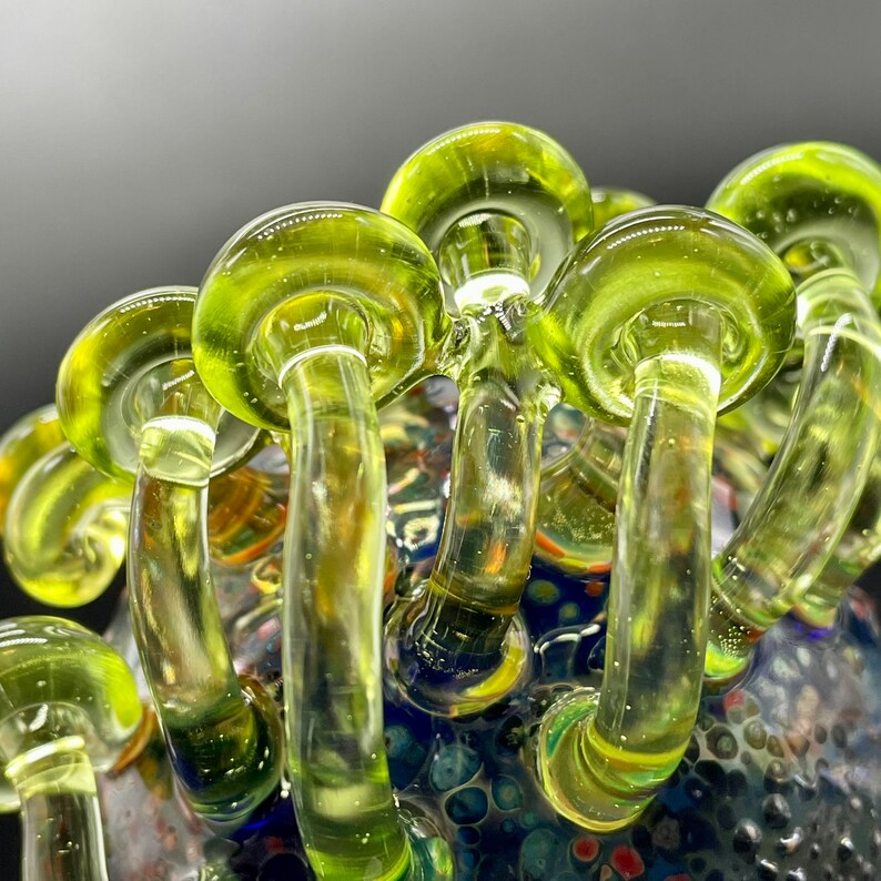 Close-up of Green mushroom cluster ornament - handcrafted glass