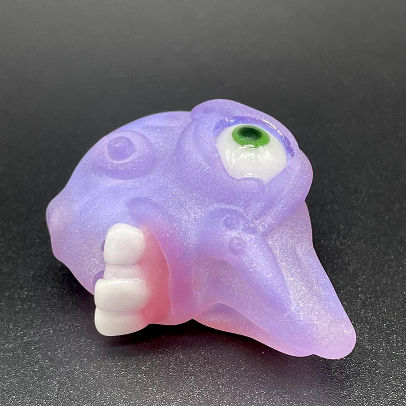 Close-up of Pink slime shnozzle pendant - handcrafted glass