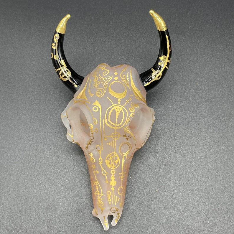 Close-up of Mystical Gold rune bull skull - handcrafted glass