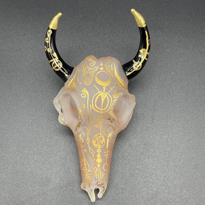 Close-up of Mystical Gold rune bull skull - handcrafted glass