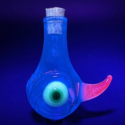 Blacklight potion bottle detail view - premium glass art