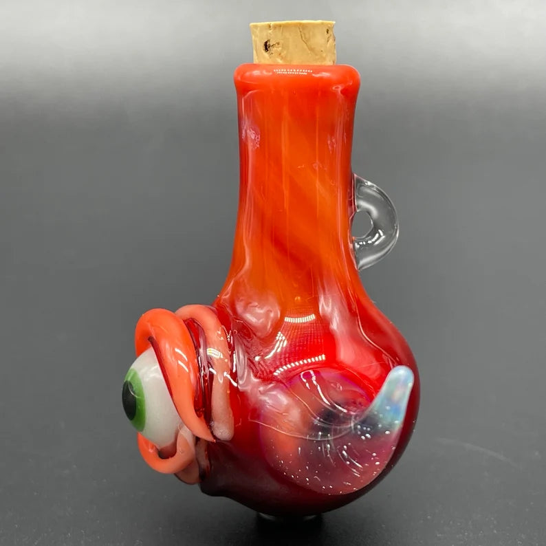 Artisan glass Red over white cyclops potion bottle - detailed craftsmanship