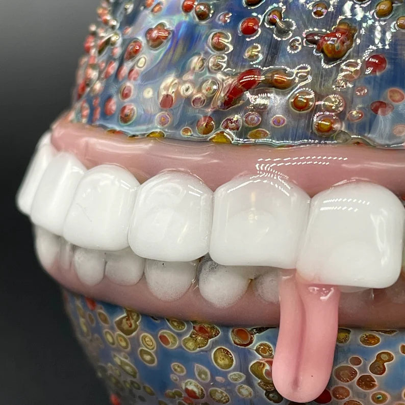 Close-up of Too many teeth ornament - handcrafted glass