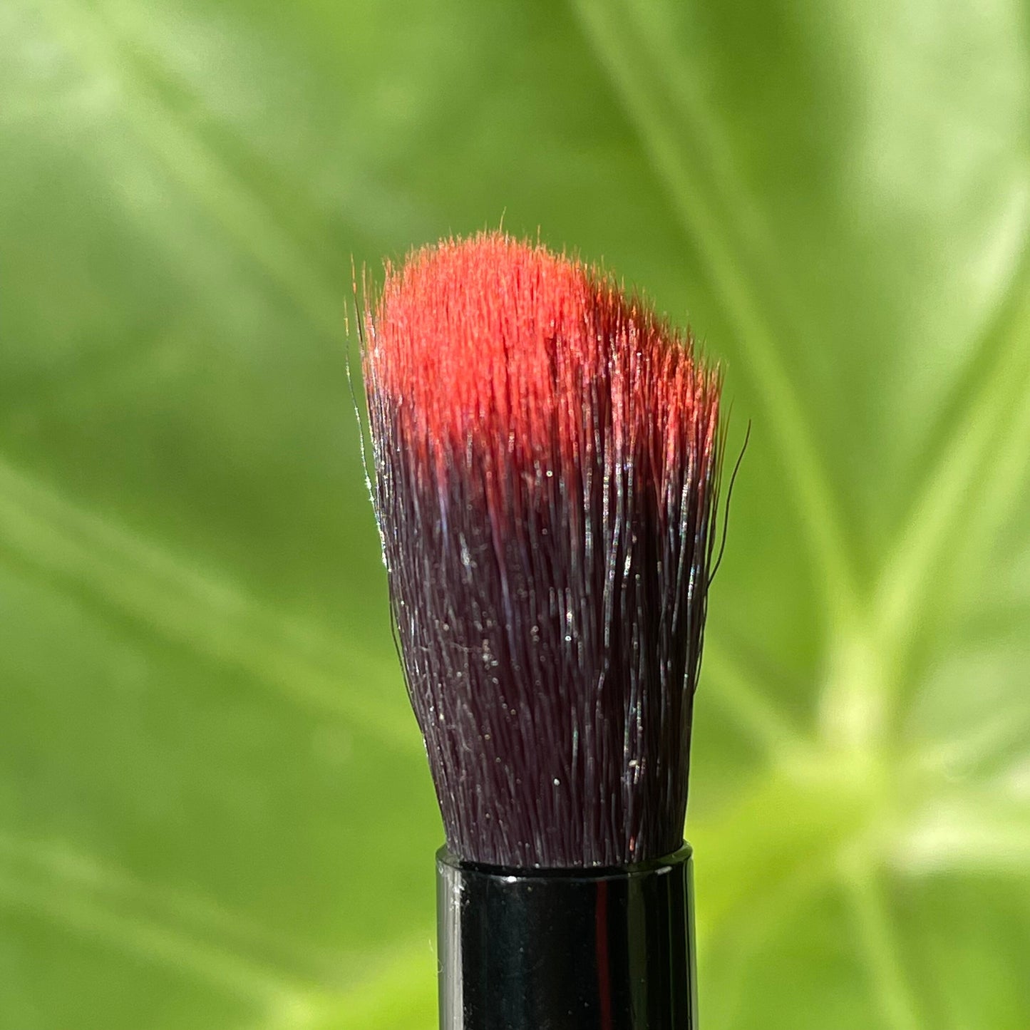 Premium Glass makeup brush with glow in the dark eye and carved ventral scales. - collectible glass art