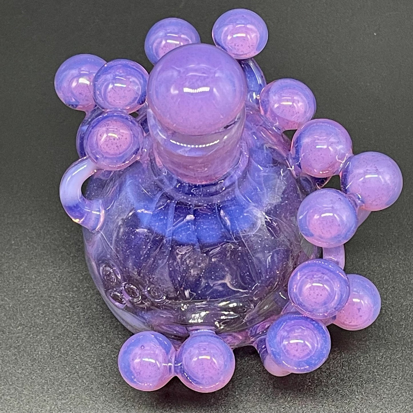 Close-up of Pink slime mushroom decanter - handcrafted glass